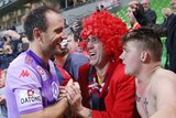 Eugene Galekovic celebrates with Adelaide United fans