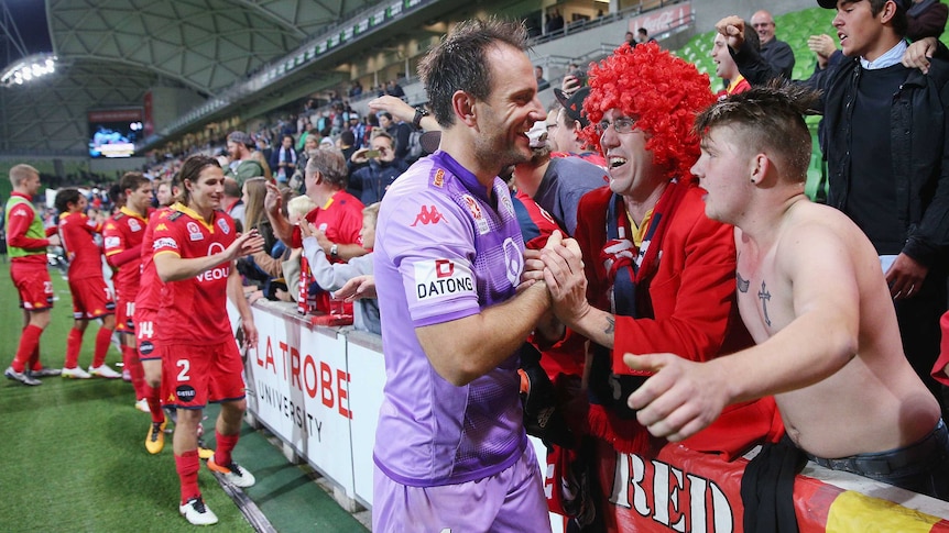 Eugene Galekovic celebrates with Adelaide United fans