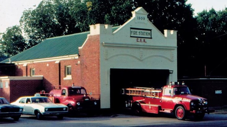 Golden Square Fire Station from 1980, with old fire engine parked outside.