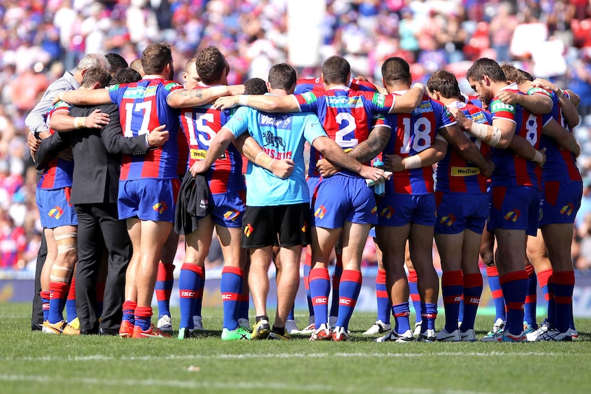 Newcastle Knights huddle for Alex McKinnon