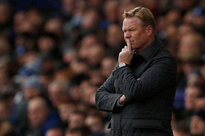 Ronald Koeman looks on from the sidelines as Everton plays Arsenal.