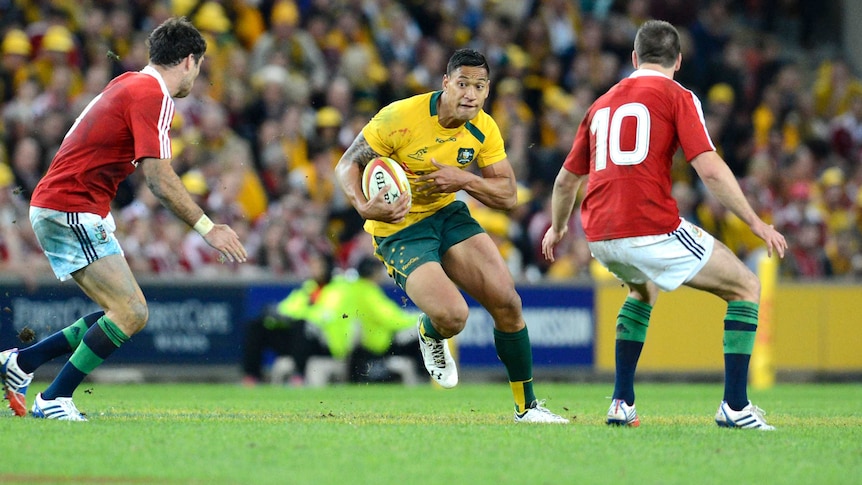 Wallabies' Israel Folau (C) in action against the British and Irish Lions at Lang Park in June 2013.