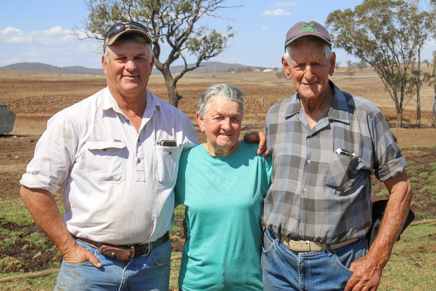 Scott Priebbenow, Chesley and Del Priebbenow stand together on their Greenmount dairy farm, October 2019.