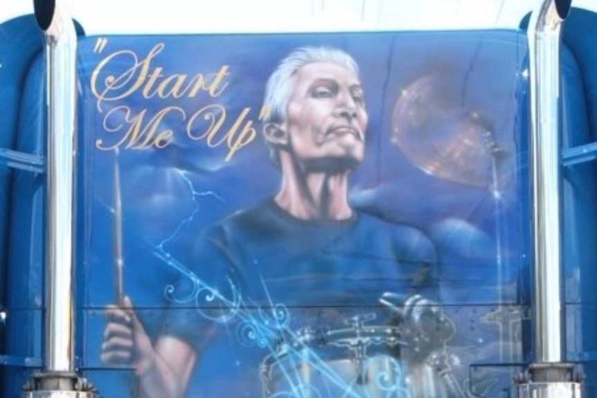 The painting of late Rolling Stones drummer Charlie Watts playing drums on rear of a truck cabin