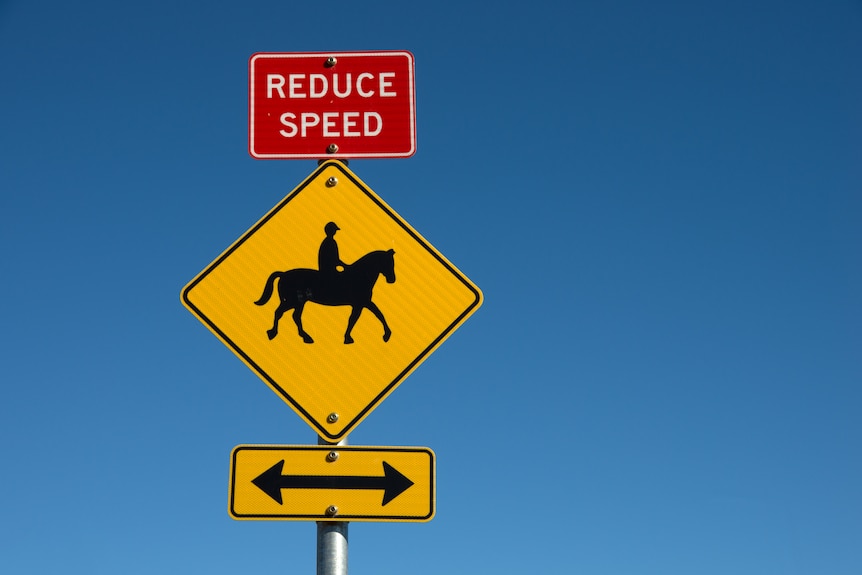 GETTY sign showing reduce speed