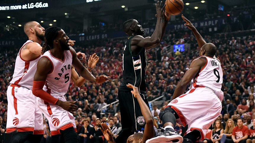 Thon Maker vies for the ball against Toronto