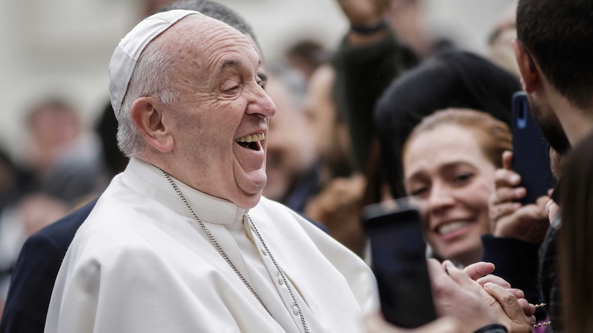 Pope Francis reacts as he leaves after the weekly General Audience at St. Peter's Square.