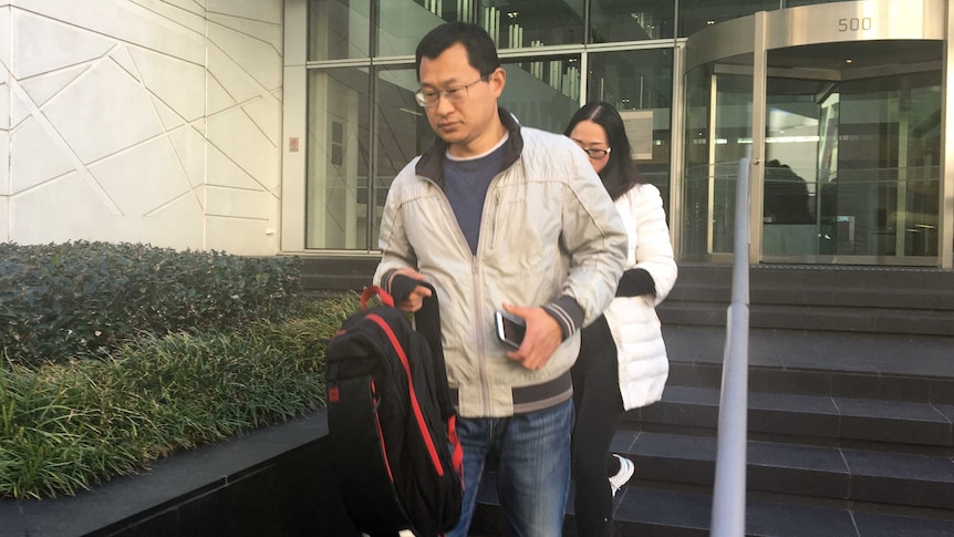 Quingwei Li leaves court.