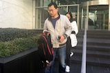 Quingwei Li leaves court.
