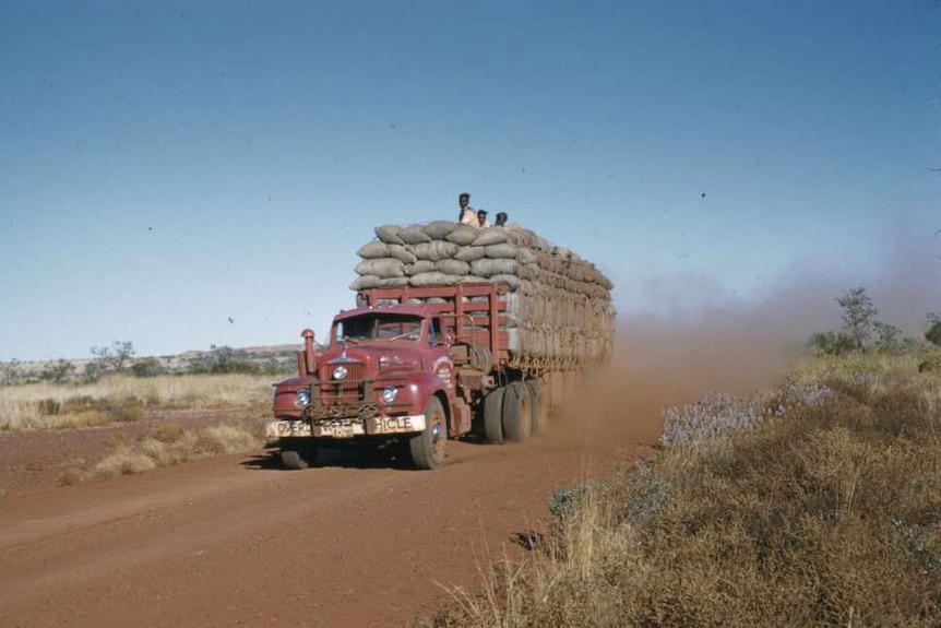 Red truck carrying asbestos from Wittenoom to the port at Point Samson.