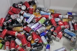 An image of a large industrial bin of empty aluminium drink cans.