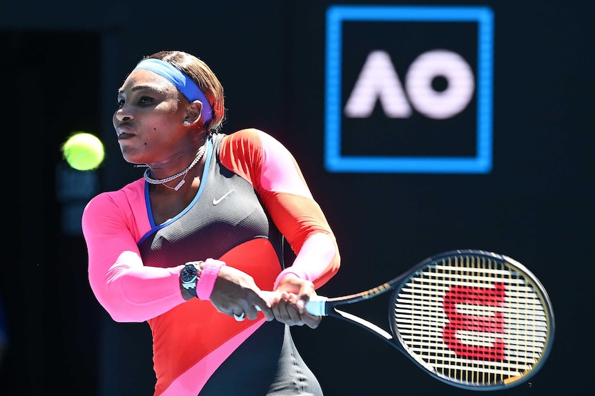 Serena Williams plays a double-handed backhand return against Naomi Osaka.