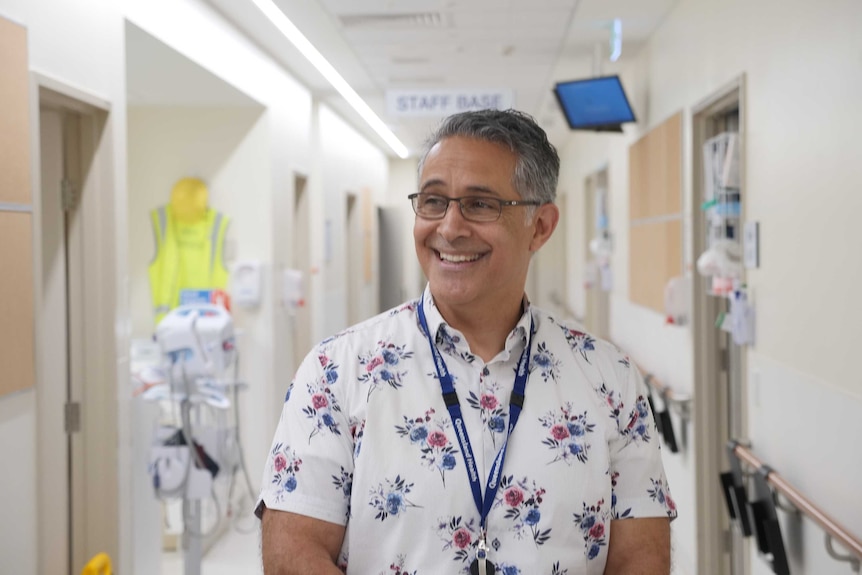 man smiling in hospital
