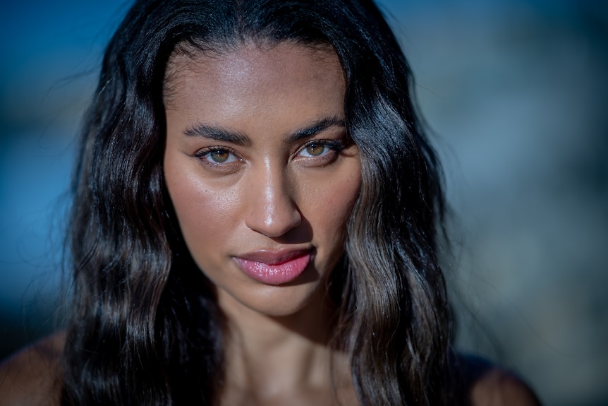 Closeup of woman looking at camera.