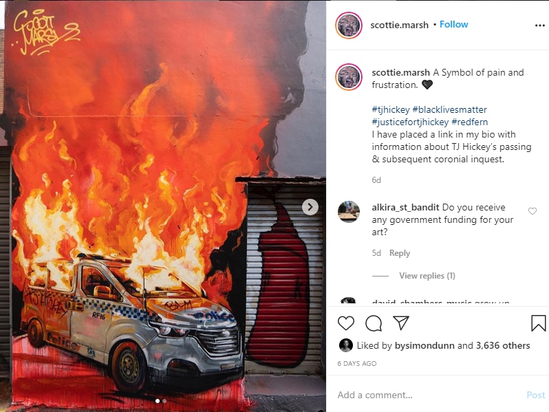 Screenshot of an Instagram post featuring a mural of a police car which is on fire.