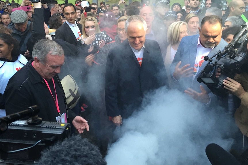 Malcolm Turnbull observes a smoking ceremony.