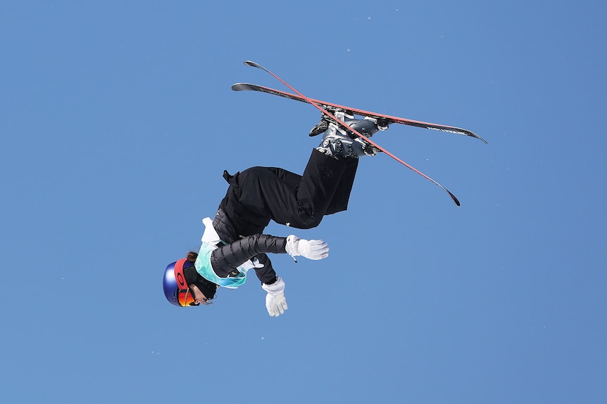 A Chinese female athlete competing in the big air event at the Beijing Winter Olympics.
