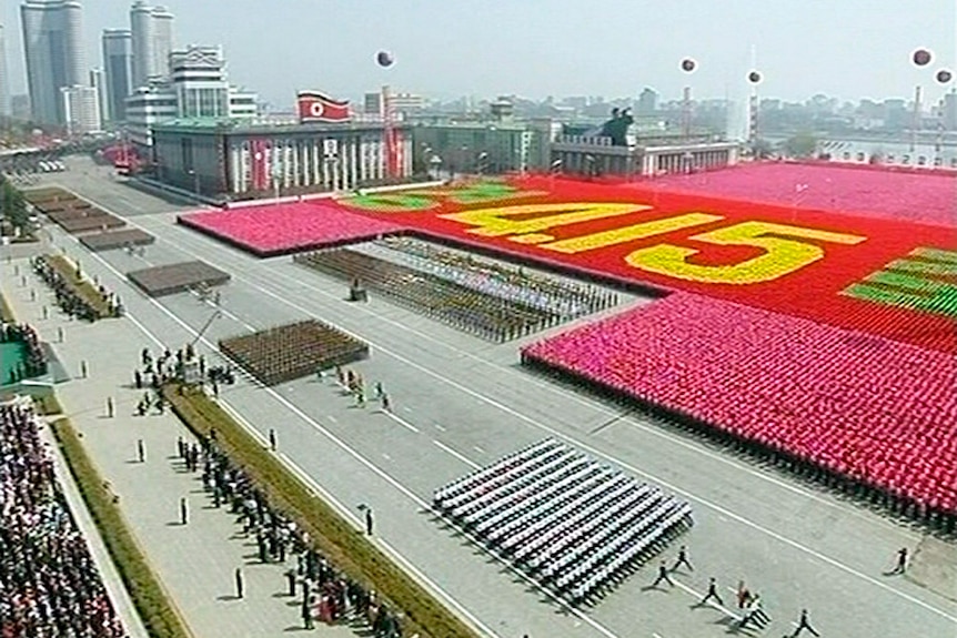 North Korean soldiers take part in a mass parade
