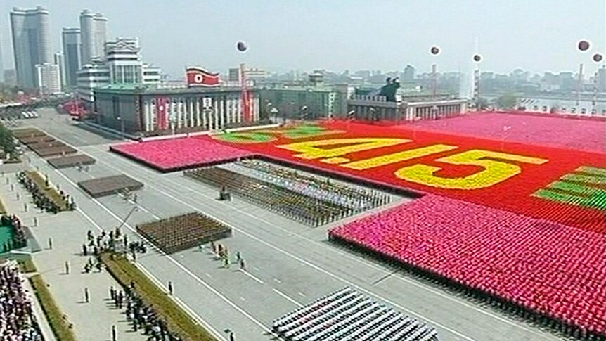 North Korean soldiers take part in a mass parade