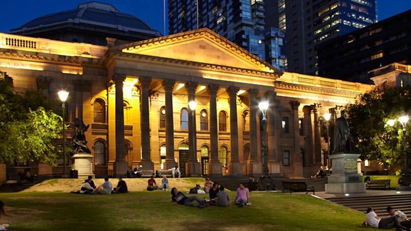 Night time exterior photo of the State Library of Victoria.