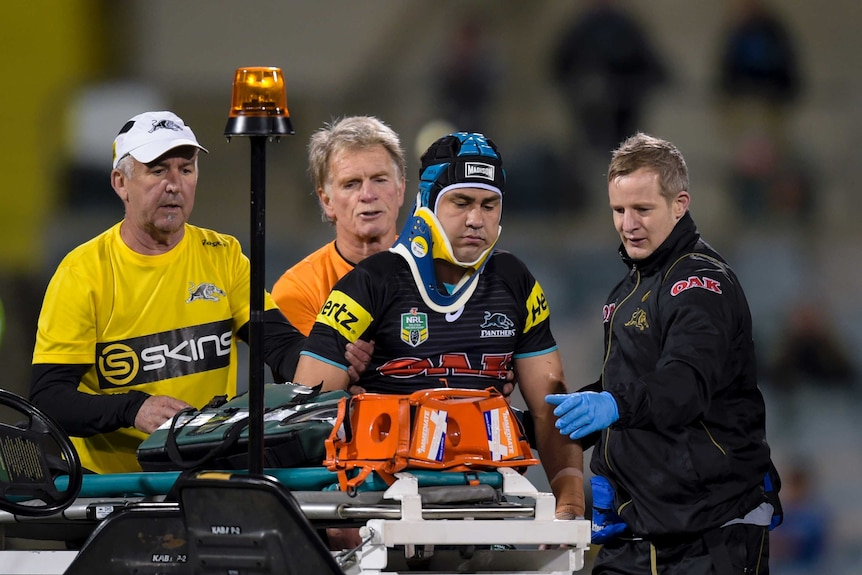 Jamie Soward leaves the field after a hit from Jack Wighton