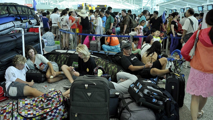 Passengers wait at Denpasar airport