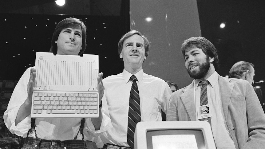 Steve Jobs, left, chairman of Apple Computers, John Sculley, center, president and CEO, and Steve Wozniak