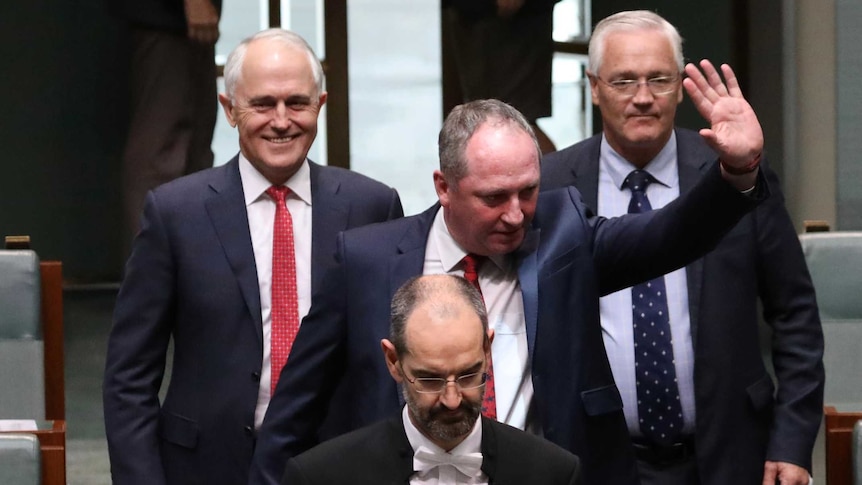 Barnaby Joyce, accompanied by usher and Malcolm Turnbull, returns to Lower House