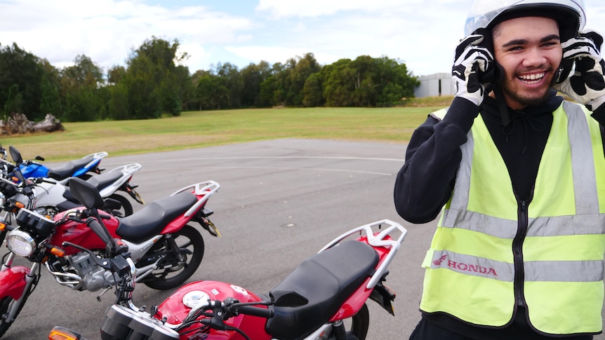 Young man in bike helmet enjoying rider training 