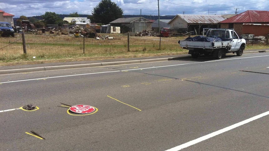A stop sign lies on a Launceston road where a worker was hit by a car.