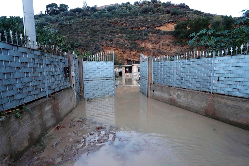 Flooding out the front of the house in Casteldaccia, Sicily, where 9 people were killed.