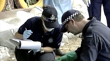 Australian forensic experts examine personal items as they attempt to identify tsunami victims in Thailand.