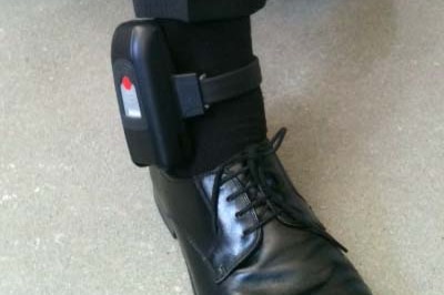 GPS tracking device around man's ankle
