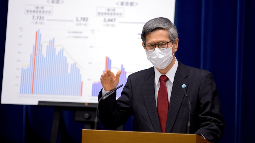 President of the Japan Community Healthcare Organization Shigeru Omi addresses a news conference.
