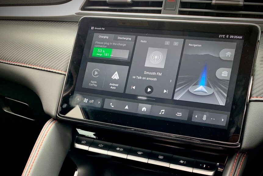 The centre display of the electric vehicle is digital, with charging ports sitting below