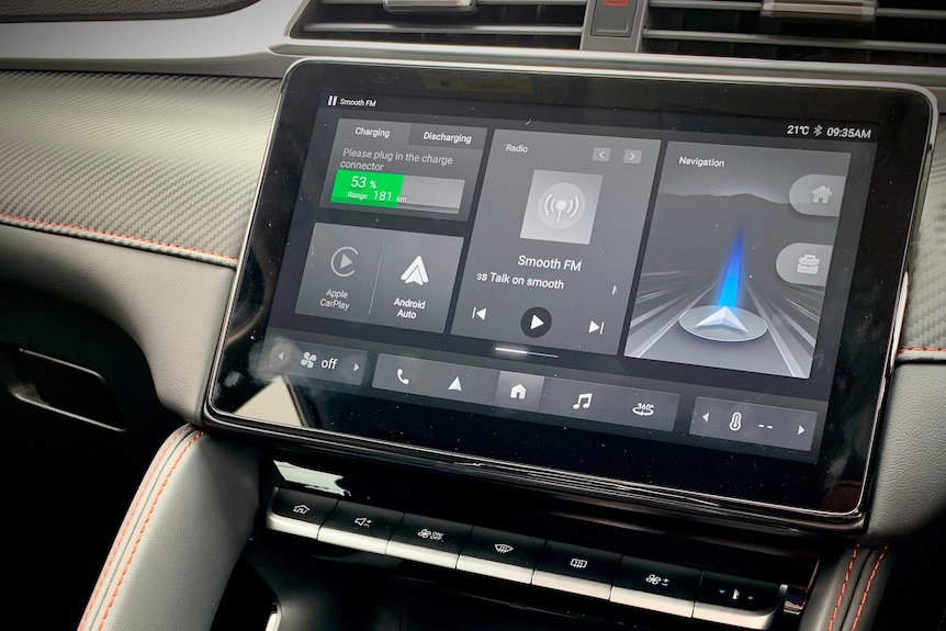 The centre display of the electric vehicle is digital, with charging ports sitting below