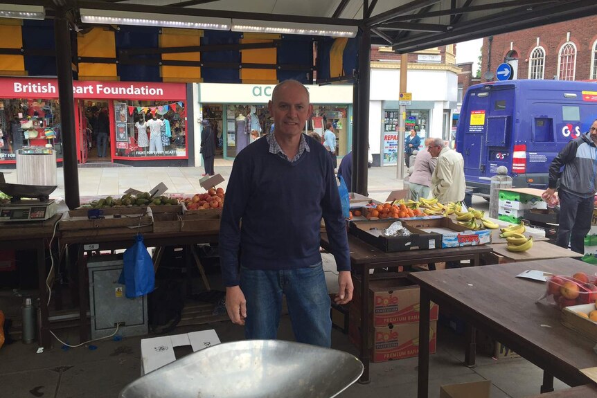 A photo of Alan, the fruit stall owner.