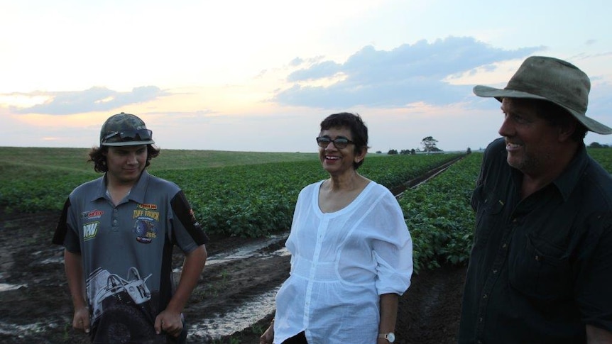 Amorelle Dempster with vegetable farmer Matt Dennis and his son Liam on their Maitland farm