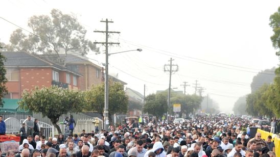 Muslims gather outside the Lakemba Mosque for morning prayers to mark the end of Ramadan