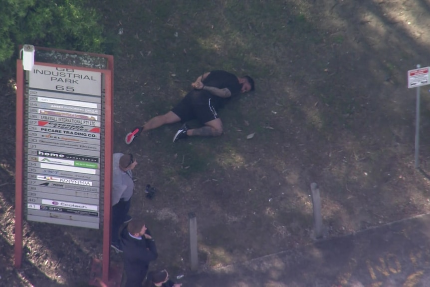 An arrested man on the ground