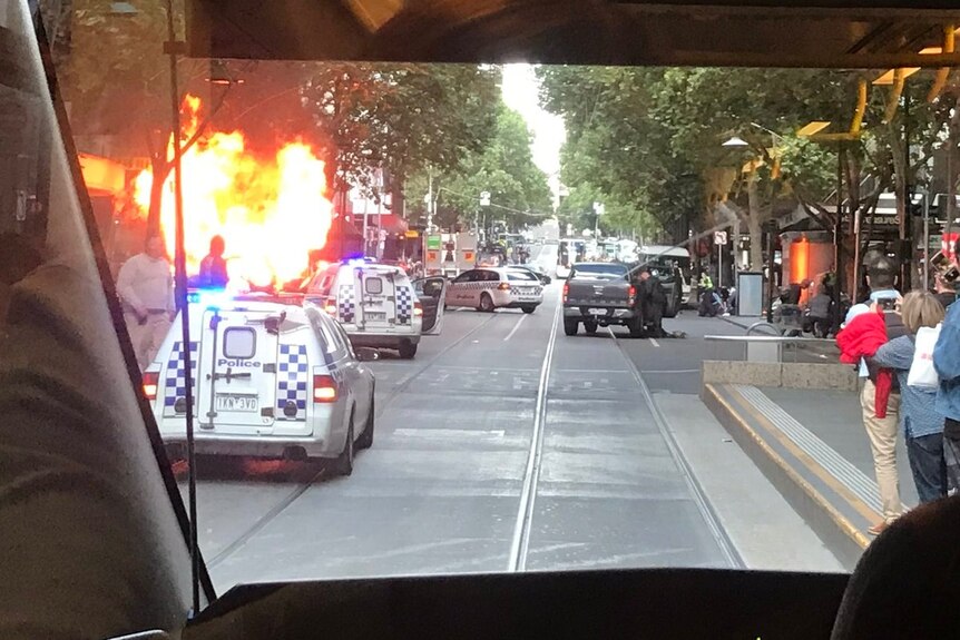 A car on fire in Bourke St, Melbourne.