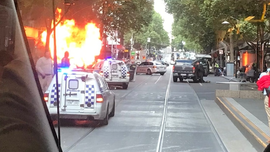 A car on fire in Bourke St, Melbourne.