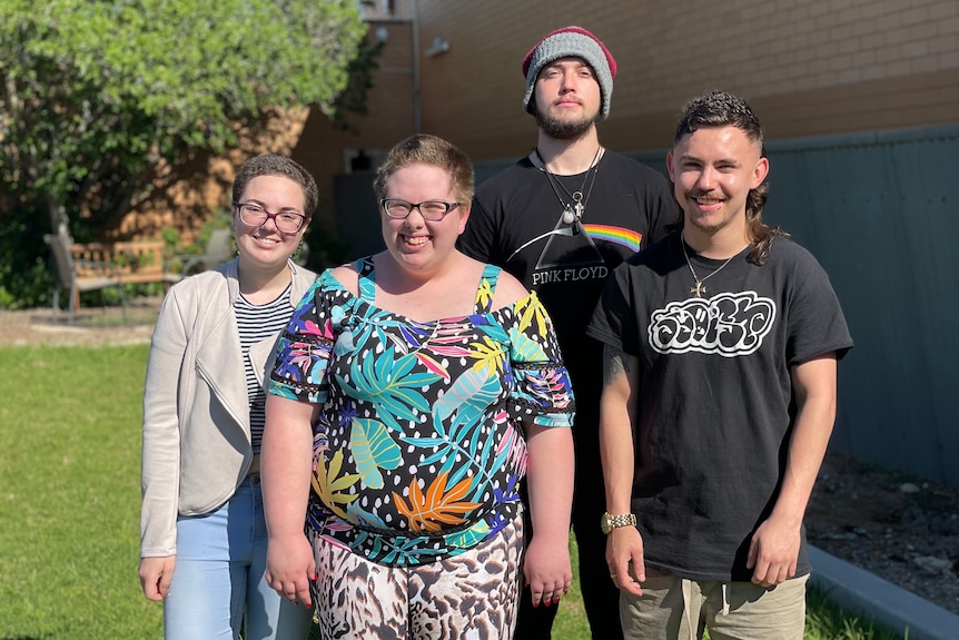 A group of people standing outside