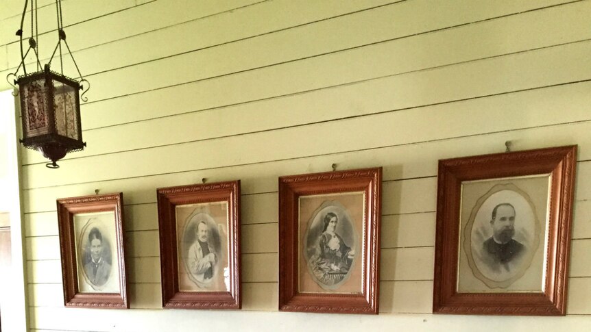 Hallways with portraits of the Wills family.