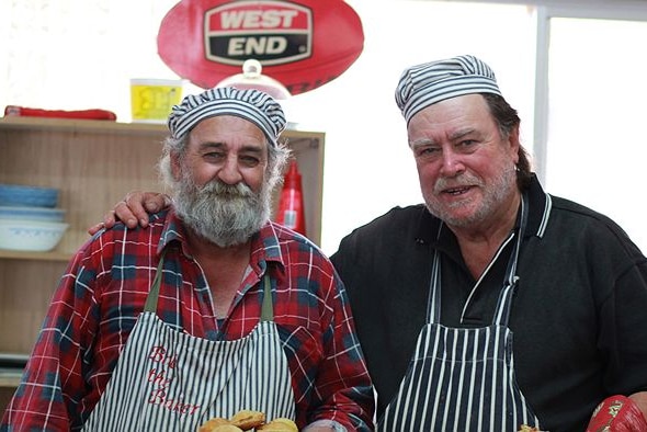 Two men standing together.