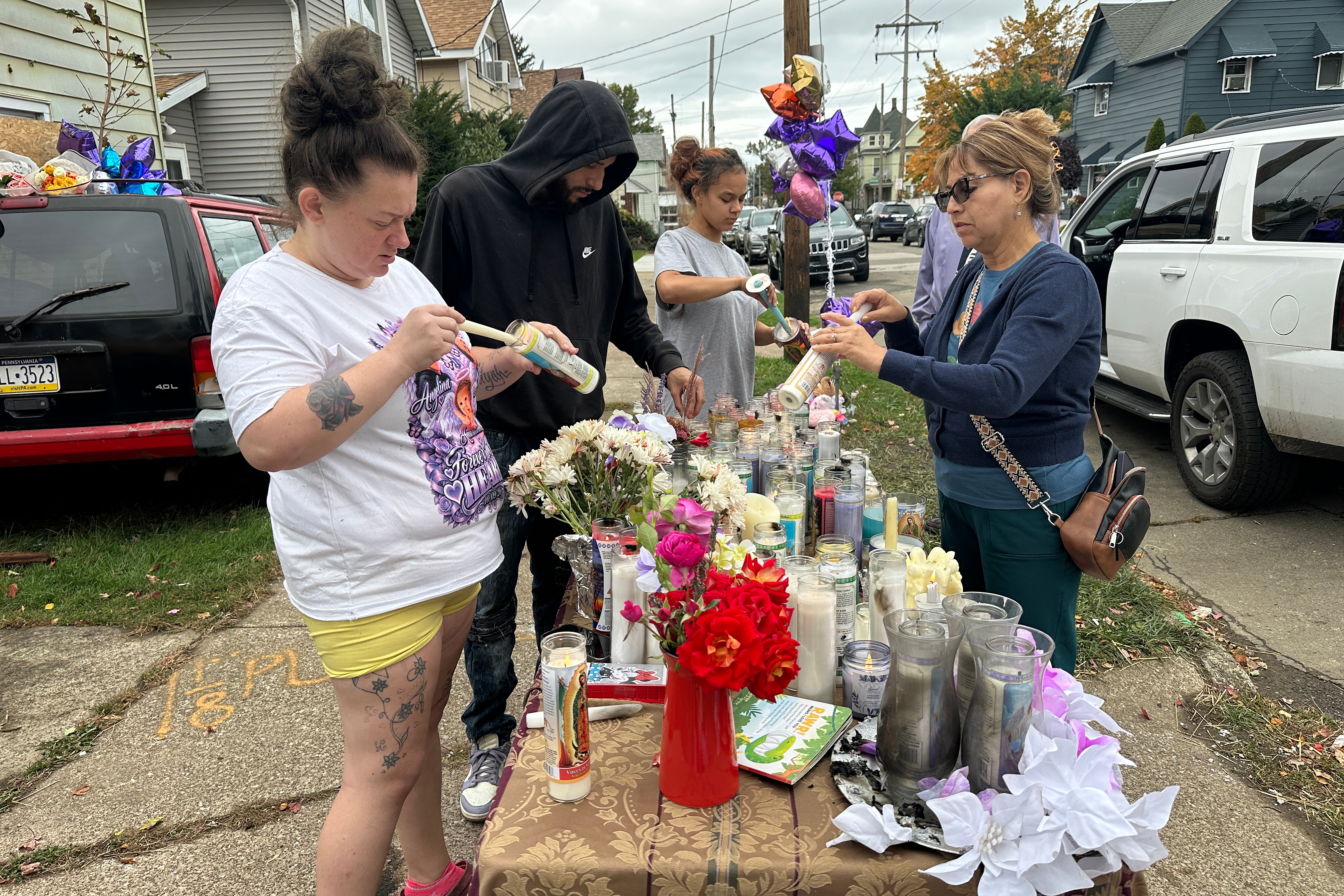 Mourners leave tributes to mass shooting victims outside Pennsylvania home