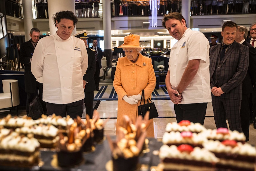 Queen Elizabeth looks at food on new P&O ship