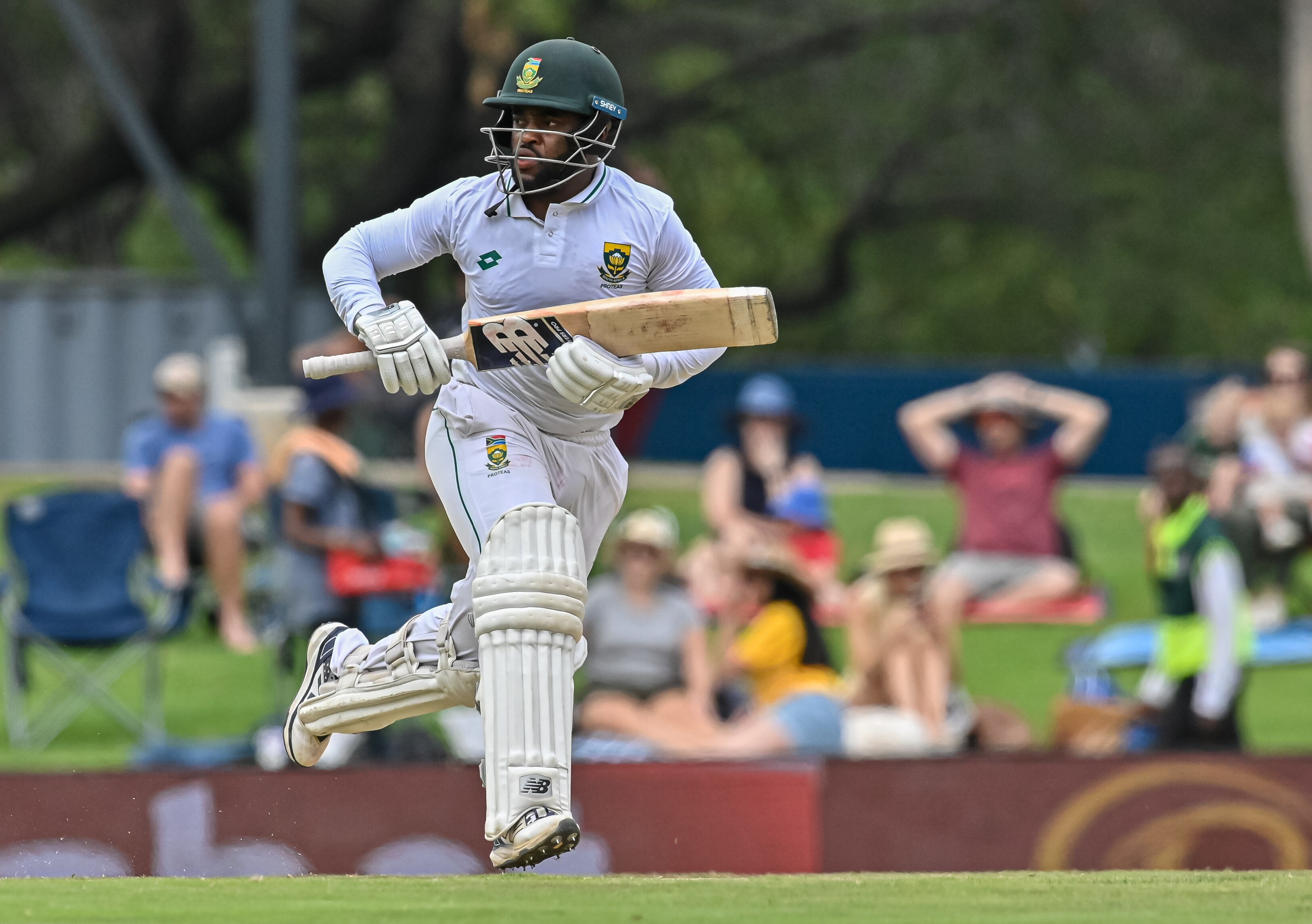 Temba Bavuma takes a run while holding his bat