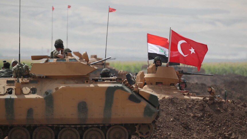 Turkish and Iraqi troops are pictured during a joint military exercise.