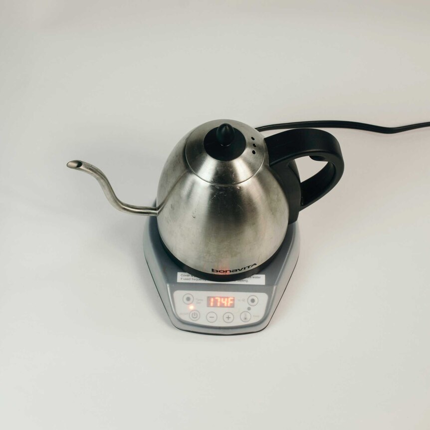 A photograph of an electric kettle with digital display